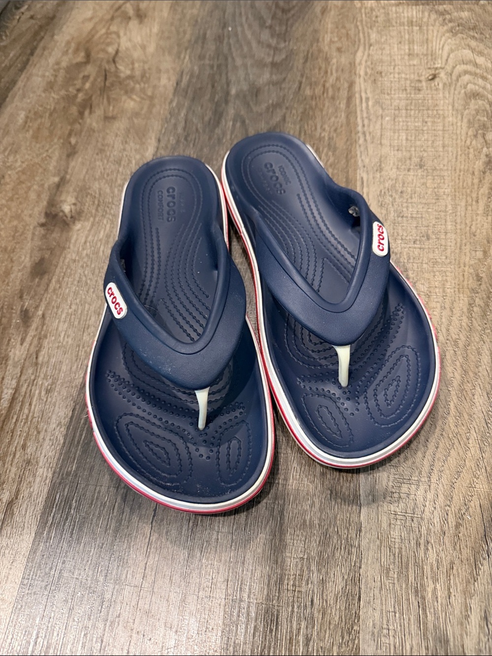 CROCS women’s Navy Blue Flip Flop Sandals with White & Red Trim